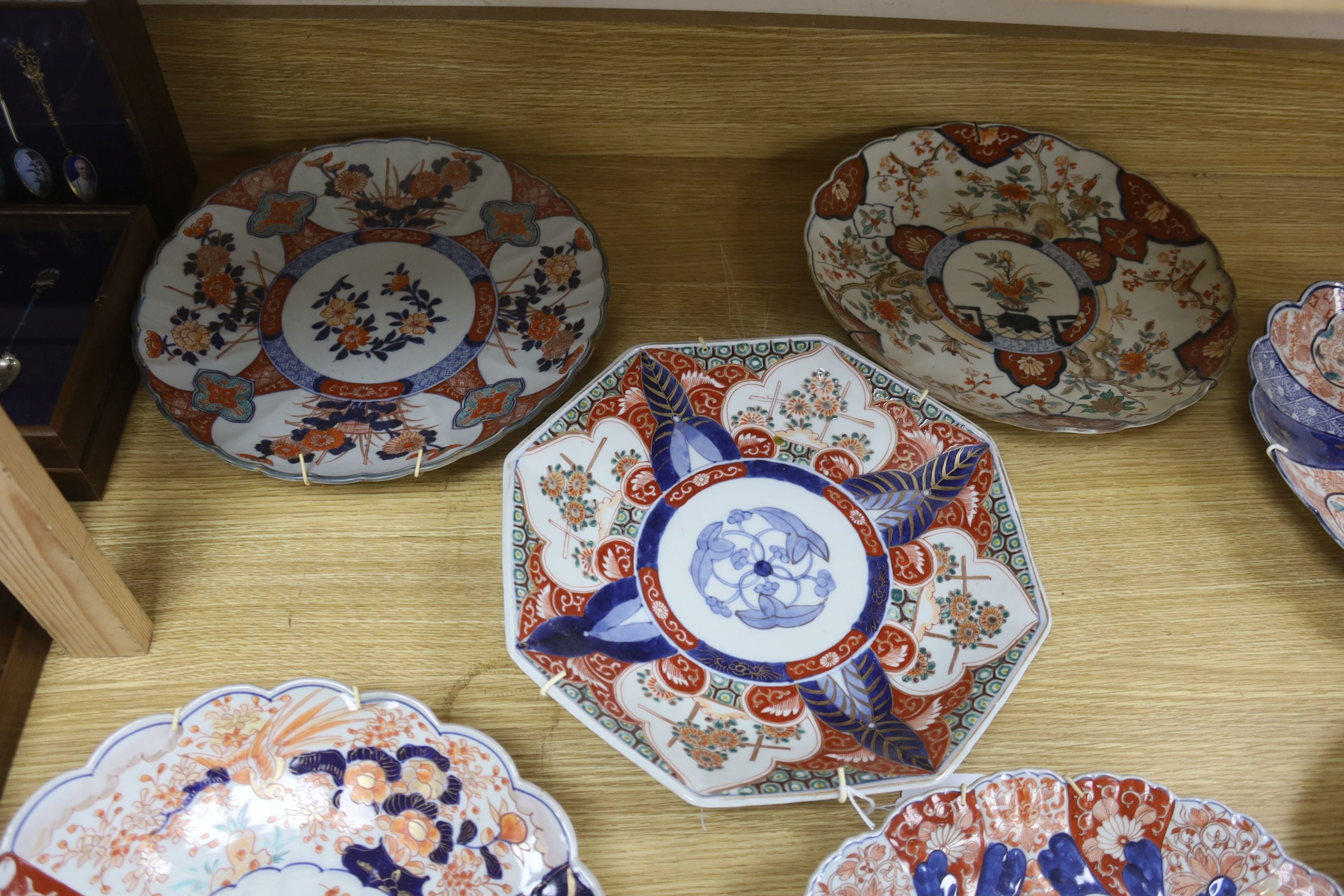 Seven various Japanese Imari dishes, late 19th century, 29.5 to 30.5cm wide